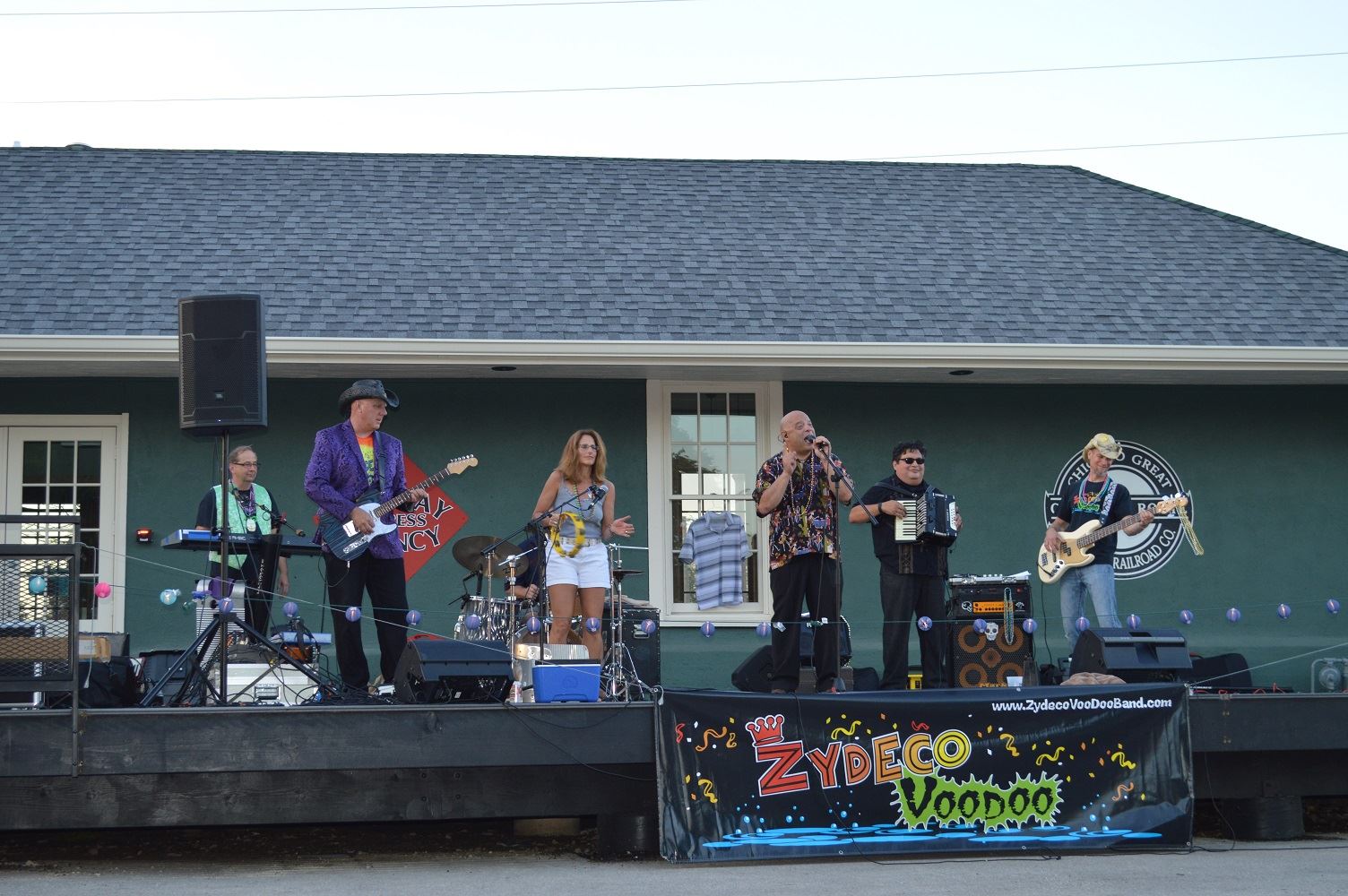 An audience member plays the tambourine with Zydeco Voodoo during a concert at Cortesi Veterans Memorial Park Aug. 25, 2016.